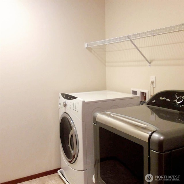 1317 52nd St NE Unit 1304, Auburn, WA 98002 - washroom with washer and dryer and baseboards