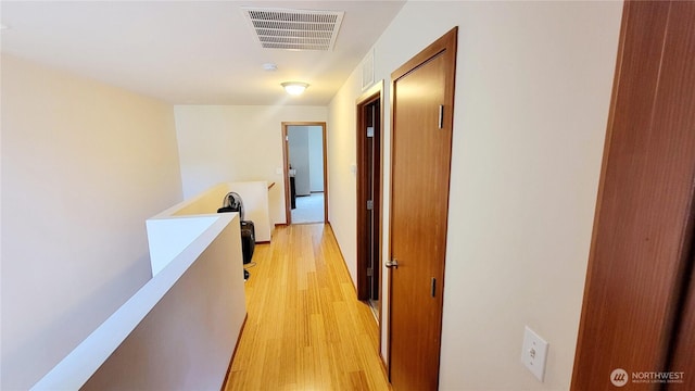 1317 52nd St NE Unit 1304, Auburn, WA 98002 - hallway featuring light wood-style floors and an upstairs landing