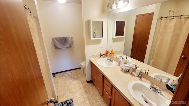 1317 52nd St NE Unit 1304, Auburn, WA 98002 - bathroom with double vanity and a shower with curtain