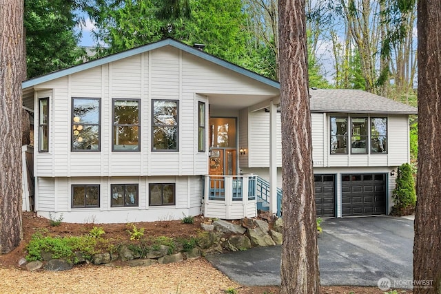 8475 SE 45th St, Mercer Island, WA 98040 - view of front of home featuring driveway, a garage, and a shingled roof