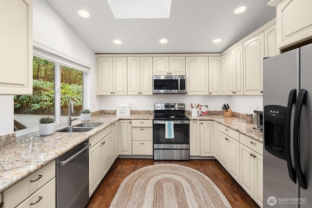 8475 SE 45th St, Mercer Island, WA 98040 - kitchen featuring stainless steel appliances, dark wood-style flooring, light stone countertops, and recessed lighting