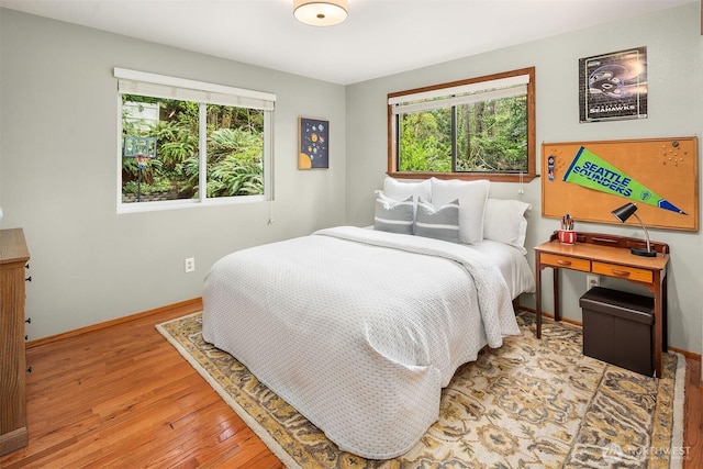 8475 SE 45th St, Mercer Island, WA 98040 - bedroom with wood finished floors and multiple windows