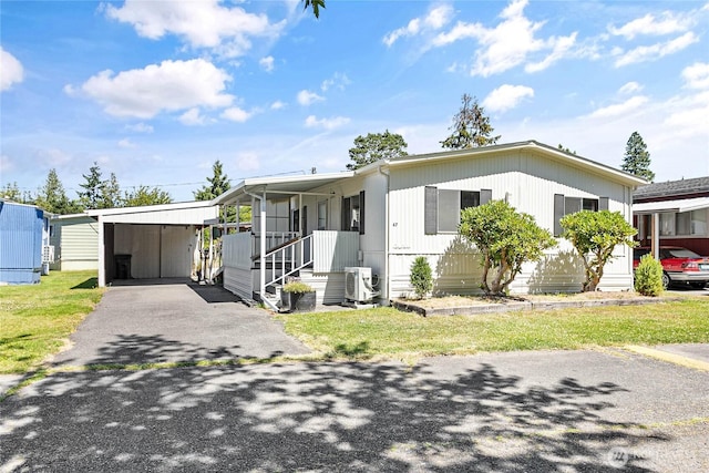 2400 Donovan Unit 67, Bellingham, WA 98225 - manufactured / mobile home featuring driveway and an attached carport
