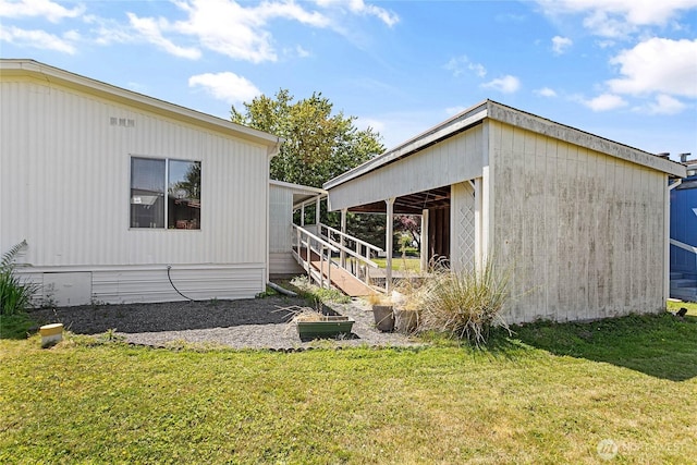 2400 Donovan Unit 67, Bellingham, WA 98225 - view of property exterior with a yard and an outbuilding