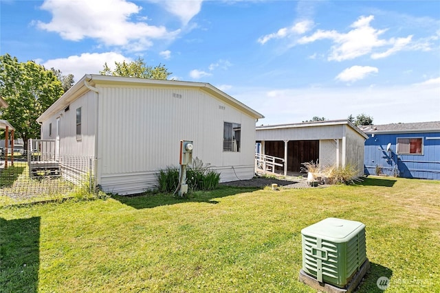 2400 Donovan Unit 67, Bellingham, WA 98225 - back of property with an outbuilding and a yard