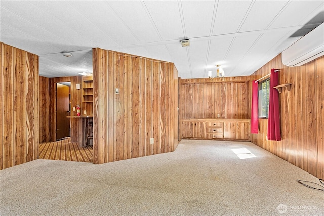 2400 Donovan Unit 67, Bellingham, WA 98225 - unfurnished room with wood walls, an AC wall unit, and carpet flooring