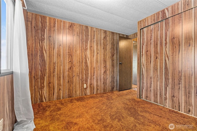 2400 Donovan Unit 67, Bellingham, WA 98225 - carpeted empty room featuring wooden walls