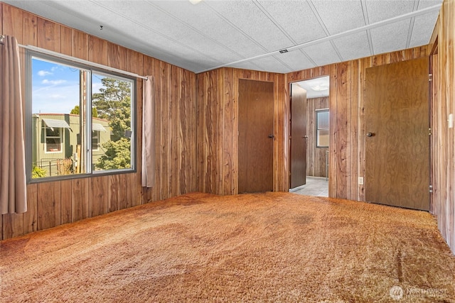 2400 Donovan Unit 67, Bellingham, WA 98225 - carpeted spare room featuring plenty of natural light and wooden walls
