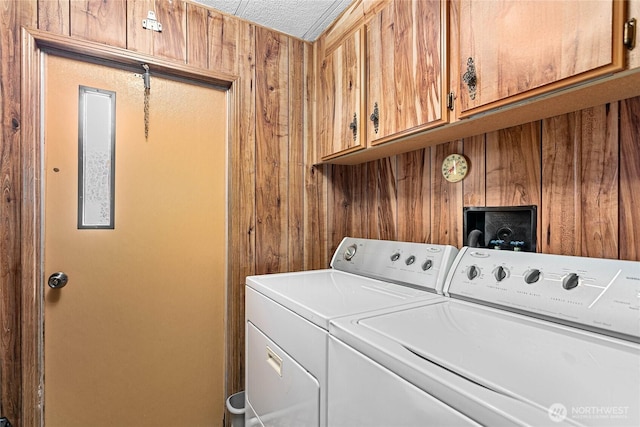 2400 Donovan Unit 67, Bellingham, WA 98225 - washroom featuring washer and clothes dryer, cabinet space, and wood walls