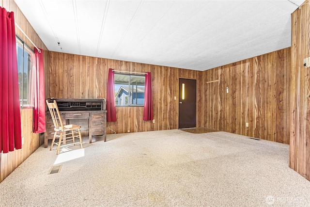 2400 Donovan Unit 67, Bellingham, WA 98225 - carpeted living room featuring healthy amount of natural light and wood walls