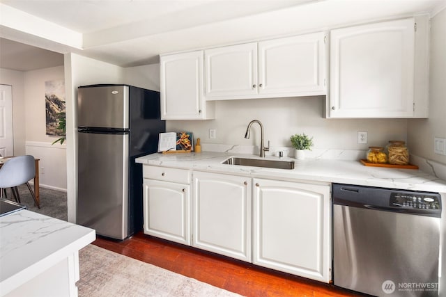 4635 W Lake Sammamish Pkwy SE Unit G206, Issaquah, WA 98027 - kitchen with stainless steel appliances, white cabinets, dark wood finished floors, and light stone countertops