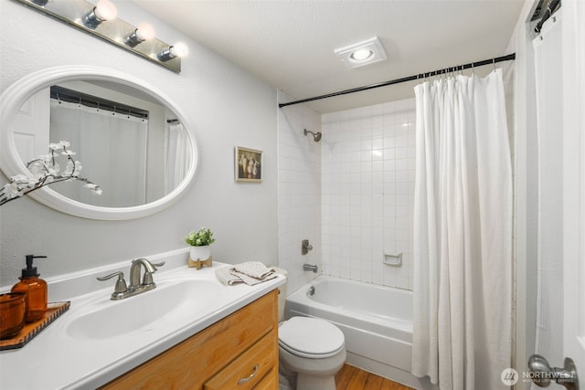 4635 W Lake Sammamish Pkwy SE Unit G206, Issaquah, WA 98027 - full bathroom featuring vanity, shower / tub combo with curtain, and wood finished floors