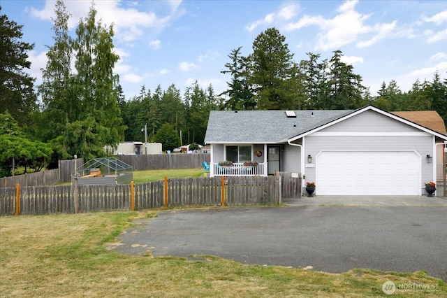 1664 Allyson St, Oak Harbor, WA 98277 - view of front of house with driveway, a garage, covered porch, a fenced front yard, and a shingled roof