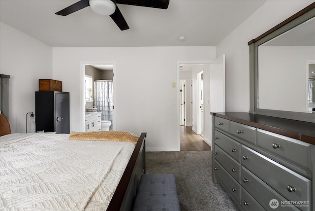 1664 Allyson St, Oak Harbor, WA 98277 - bedroom featuring dark carpet, a ceiling fan, and connected bathroom