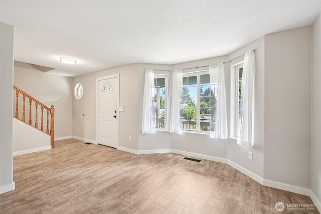 212 SW 2nd Ct, Battle Ground, WA 98604 - entryway featuring wood finished floors, stairway, and a textured ceiling