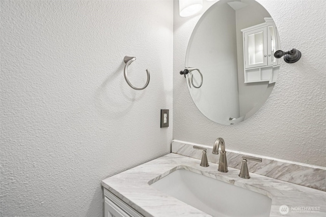212 SW 2nd Ct, Battle Ground, WA 98604 - bathroom featuring a textured wall and vanity