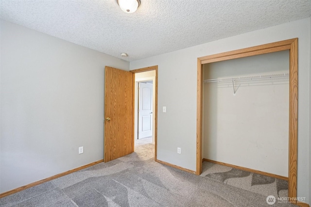 212 SW 2nd Ct, Battle Ground, WA 98604 - unfurnished bedroom with carpet floors, a closet, and a textured ceiling