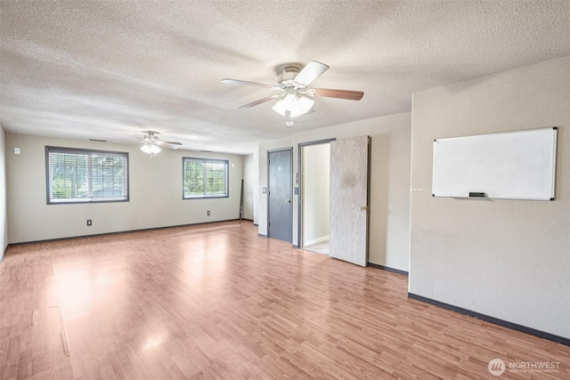 212 SW 2nd Ct, Battle Ground, WA 98604 - empty room with ceiling fan, a textured ceiling, and wood finished floors
