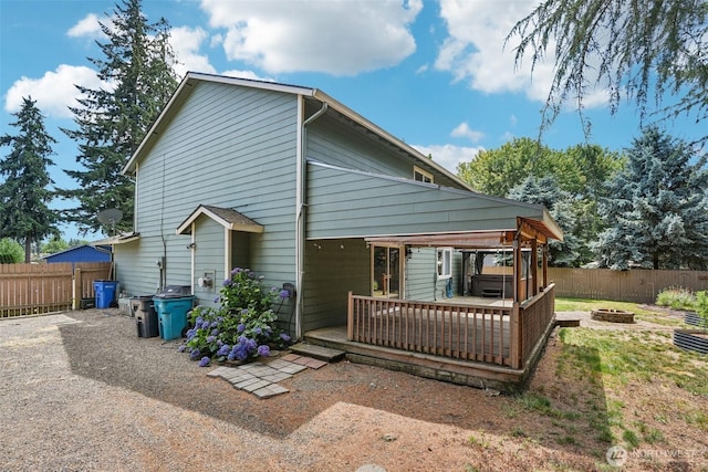 212 SW 2nd Ct, Battle Ground, WA 98604 - rear view of property with a fire pit, a deck, and a fenced backyard