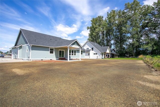 1204 E Georgia Ln, Everson, WA 98247 - back of property with a shingled roof and crawl space