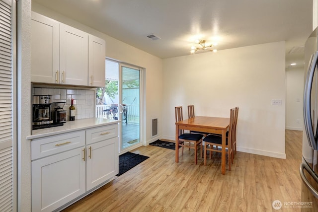 302 126th St S, Parkland, WA 98444 - dining room featuring light wood-type flooring and a chandelier