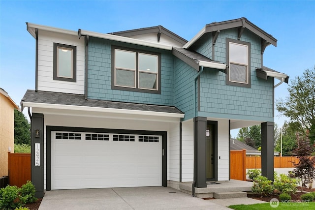 12433 SE 256th Pl Unit 4, Kent, WA 98030 - view of front of house featuring an attached garage, roof with shingles, and concrete driveway