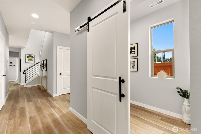 12433 SE 256th Pl Unit 4, Kent, WA 98030 - hall with a barn door, light wood-type flooring, stairway, and recessed lighting