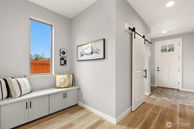 12433 SE 256th Pl Unit 4, Kent, WA 98030 - entrance foyer with a barn door, recessed lighting, and light wood finished floors