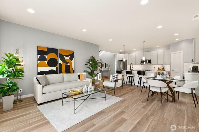 12433 SE 256th Pl Unit 4, Kent, WA 98030 - living room with light wood-type flooring and recessed lighting