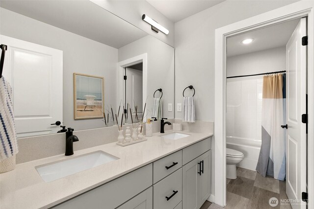 12433 SE 256th Pl Unit 4, Kent, WA 98030 - bathroom featuring double vanity, shower / tub combo with curtain, and wood finished floors