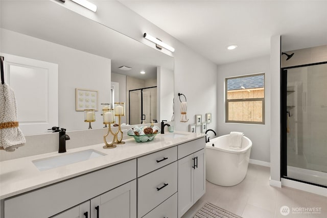 12433 SE 256th Pl Unit 4, Kent, WA 98030 - bathroom featuring a shower stall, double vanity, a freestanding bath, tile patterned flooring, and recessed lighting