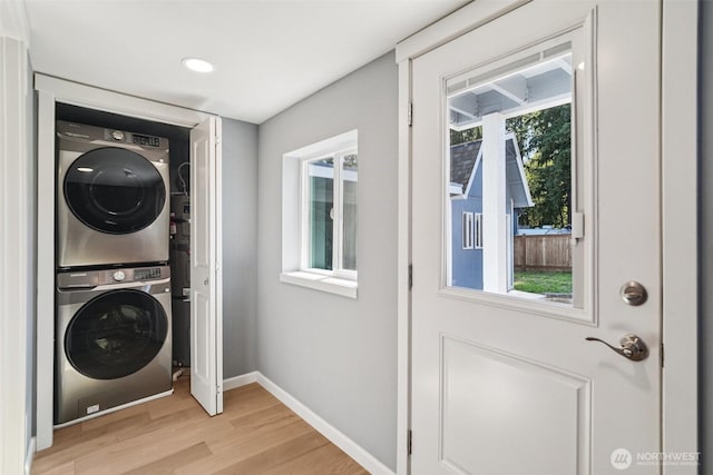 14427 156th Ave SE, Renton, WA 98059 - laundry area with stacked washer and clothes dryer, light wood-type flooring, and recessed lighting