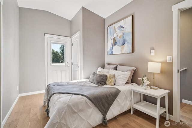 14427 156th Ave SE, Renton, WA 98059 - bedroom featuring light wood-type flooring and lofted ceiling