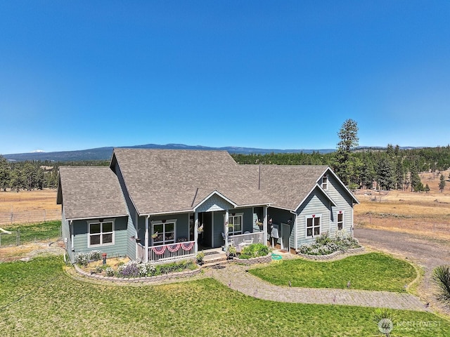 505 Woodland Rd, Goldendale, WA 98620 - ranch-style house featuring a porch, a front lawn, and a shingled roof