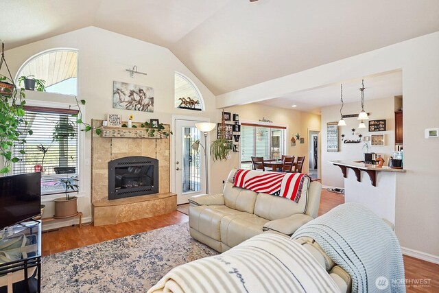 505 Woodland Rd, Goldendale, WA 98620 - living room featuring plenty of natural light, lofted ceiling, wood finished floors, and a fireplace