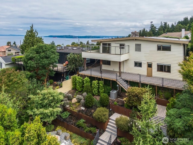 5621 SW Manning St, Seattle, WA 98116 - back of property featuring a water view and a chimney