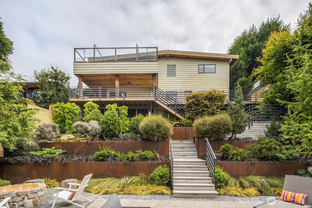 5621 SW Manning St, Seattle, WA 98116 - rear view of property featuring stairway