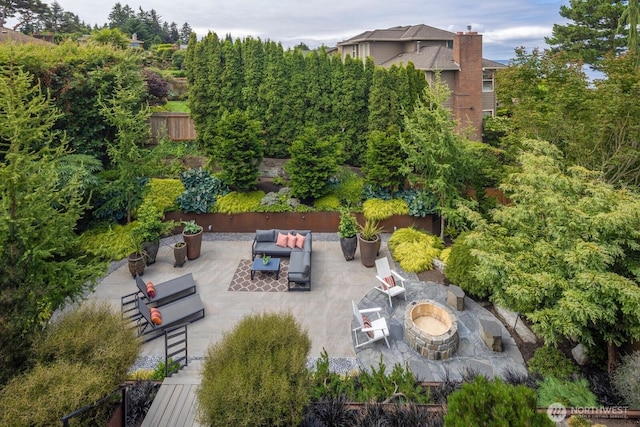 5621 SW Manning St, Seattle, WA 98116 - view of patio / terrace with an outdoor living space with a fire pit