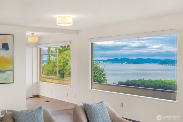 5621 SW Manning St, Seattle, WA 98116 - sitting room with baseboards and a mountain view