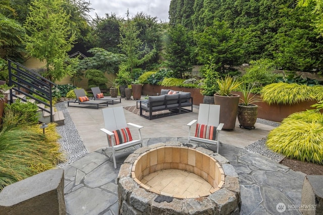 5621 SW Manning St, Seattle, WA 98116 - view of patio / terrace with an outdoor living space with a fire pit