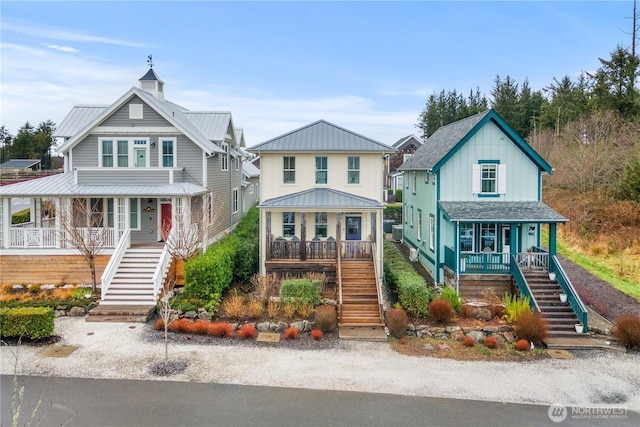 26 Lavender Ln, Pacific Beach, WA 98571 - view of front of property featuring stairs, covered porch, and a metal roof
