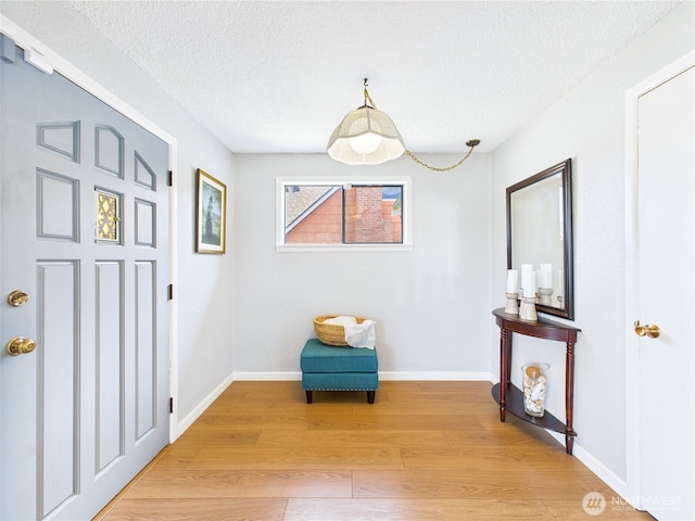 1006 E Harrison St, Tacoma, WA 98404 - sitting room with a textured ceiling and light wood-style flooring