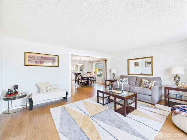 1006 E Harrison St, Tacoma, WA 98404 - living room with wood finished floors and a textured ceiling