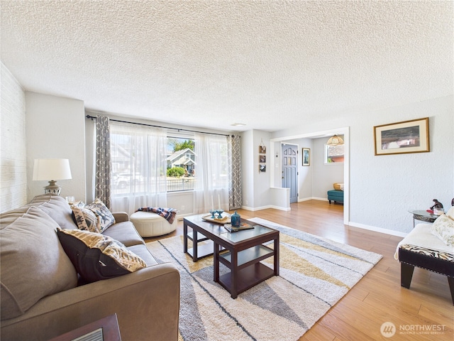 1006 E Harrison St, Tacoma, WA 98404 - living area featuring wood finished floors and a textured ceiling