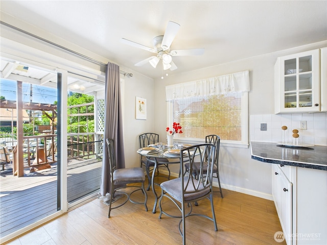 1006 E Harrison St, Tacoma, WA 98404 - dining space featuring light wood-style floors, plenty of natural light, and a ceiling fan
