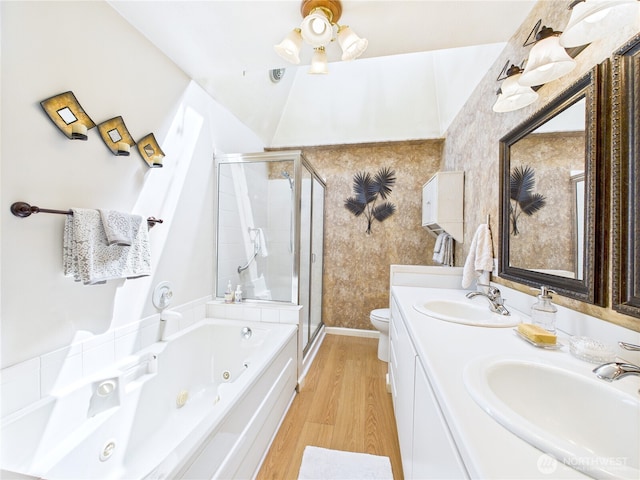 1006 E Harrison St, Tacoma, WA 98404 - full bath with a shower stall, a tub with jets, wood finished floors, and double vanity