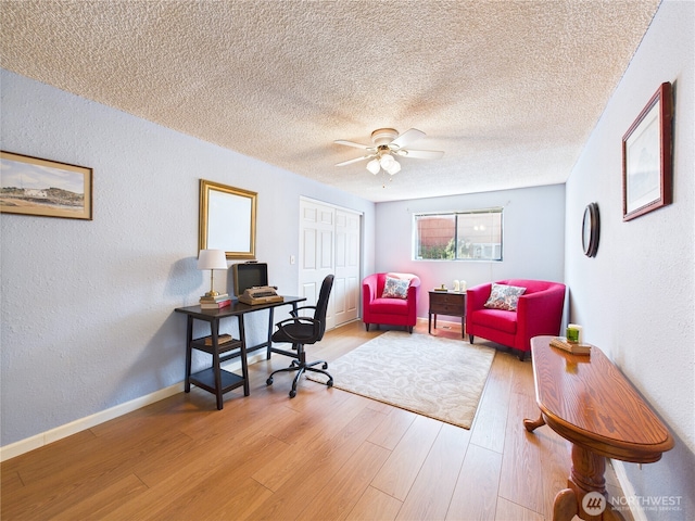 1006 E Harrison St, Tacoma, WA 98404 - office space featuring wood finished floors, ceiling fan, a textured wall, and a textured ceiling