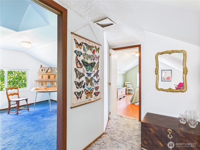 1006 E Harrison St, Tacoma, WA 98404 - hall featuring lofted ceiling, carpet, and a textured ceiling