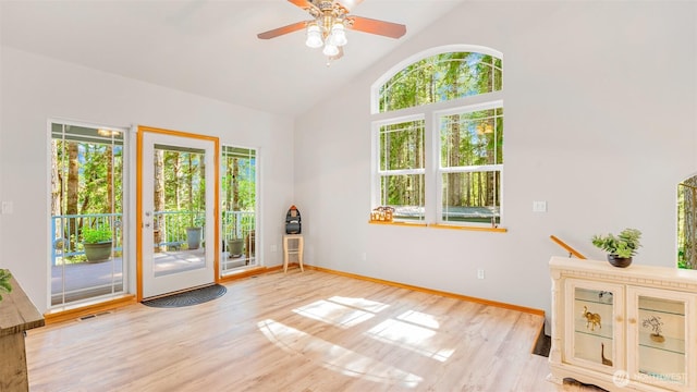 250 E Crest Ln, Grapeview, WA 98546 - spare room with healthy amount of natural light, light wood-type flooring, a ceiling fan, and high vaulted ceiling