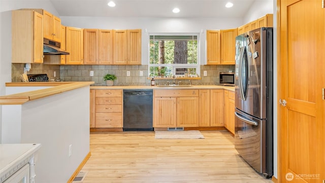 250 E Crest Ln, Grapeview, WA 98546 - kitchen with black appliances, extractor fan, light wood-type flooring, light countertops, and light brown cabinets